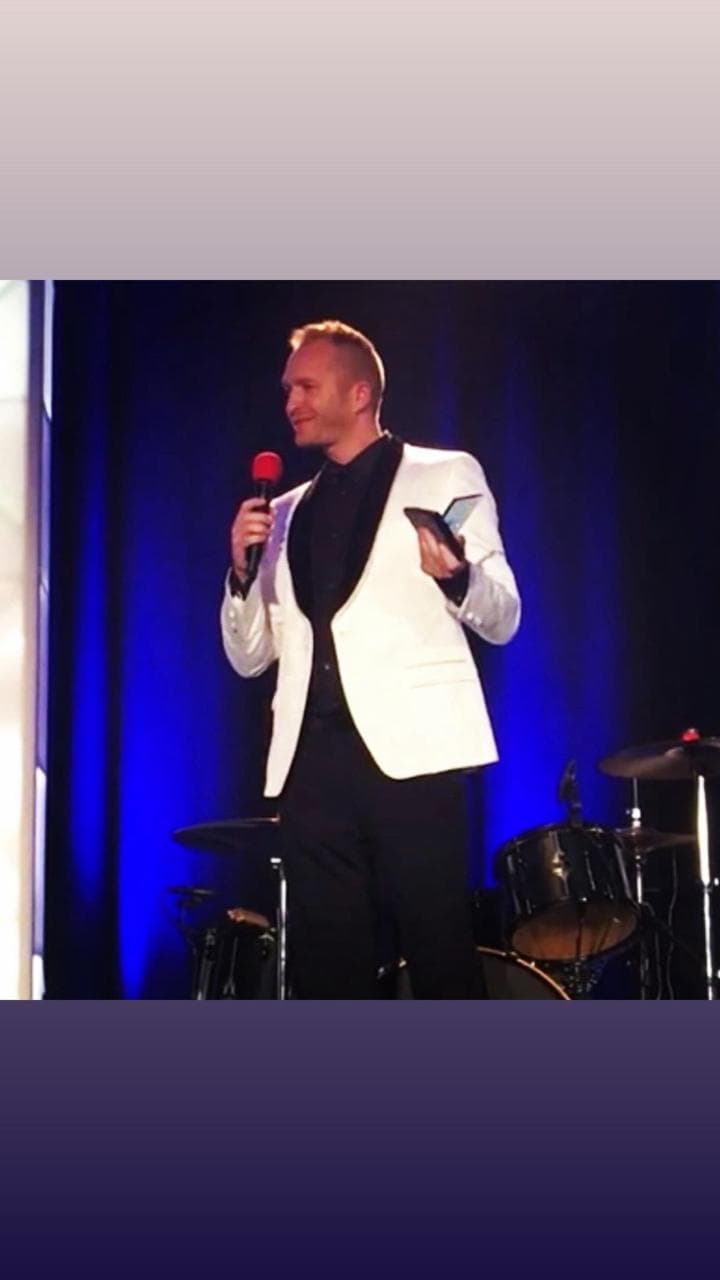 Michael Beal speaking from stage